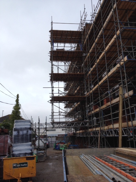 Scaffolding erectors working on a professional construction site